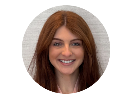 A smiling person with long reddish-brown hair is shown against a plain background.